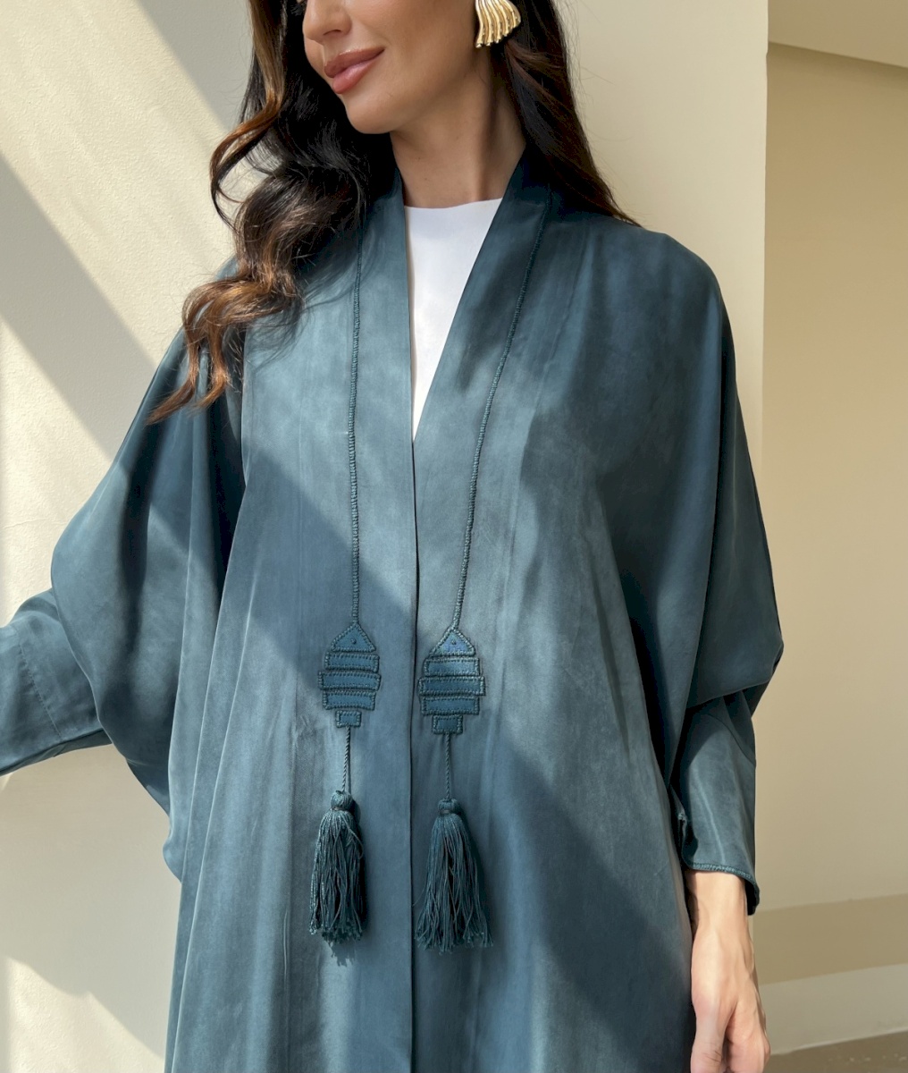 Teal fish tassel cloak